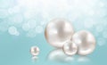 Four white pearls on aqua shimmering light background Royalty Free Stock Photo