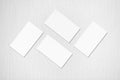 Four white rectangle business card mockups on grey background