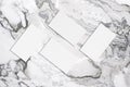 Four white rectangle business card mockups on grey marble background