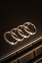 four white rings are on top of an older audi grille