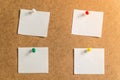 Four white stickers for taking notes on a cardboard background