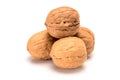 Four whole walnuts, close up macro, isolated on a white background Royalty Free Stock Photo