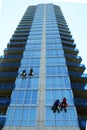 Four window washers on skyscraper