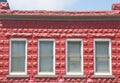 Four Windows in Red Block Building Royalty Free Stock Photo