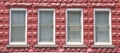 Four Windows in Red Block Building Royalty Free Stock Photo