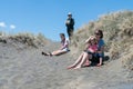 Four women in dunes on Muriwai Beach Royalty Free Stock Photo