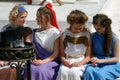 Four women in historical costumes