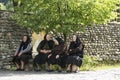 four women sitting on a bench in Romania Royalty Free Stock Photo