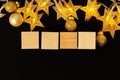 Four wooden blocks with deocrative stars. New Year concept