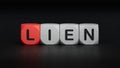 Four wooden cubes arranged in stack with word LIEN on them, space for text. Royalty Free Stock Photo