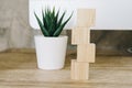 Four wooden toy cubes on wooden table background with copy space Royalty Free Stock Photo