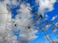 Four workers install a new high-voltage power line.