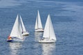 Four yachts making a close turn near buoy