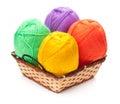 Four yarn skeins in yellow, orange, green, purple colors Royalty Free Stock Photo