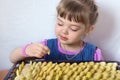 Four-year little girl preparing apple pie