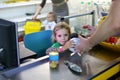 Four year old caucasian toddler girl playing to be a cashier at supermarket Royalty Free Stock Photo