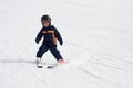 Four year old child skiing alone