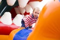 Four-year-old kid playing on a trampoline