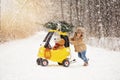 A little happy boy in snowing winter Royalty Free Stock Photo