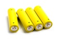 Four yellow alkaline batteries Royalty Free Stock Photo
