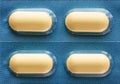 Four yellow oblong pills in a blister