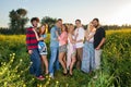 Four young couples in the country at sunset. Royalty Free Stock Photo