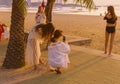 Four,young female Chinese tourists did a bikini shooting on the beach of Pattaya