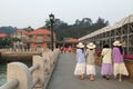 Four young ladies walking on a wharf in Gulangyu island in Xiamen city, China