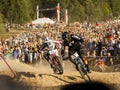 Fourcross biker race, fight on the race with people on background - editorial
