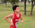 Fourteen year-old Amerasian boy running a cross country race in Oklahoma.