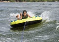 Fourteen year-old Amerasian boy tubing on Grand Lake in Oklahoma. Royalty Free Stock Photo