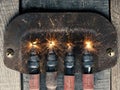 Fourth Advent background with four spark plugs on rusty sign, car workshop advent Royalty Free Stock Photo