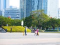 Shenzhen, China: men and women, children and other citizens or tourists relax in parks during the Spring Festival holiday