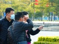 Shenzhen, China: men and women, children and other citizens or tourists relax in parks during the Spring Festival holiday