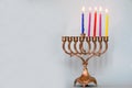 Fourth day of Hanukkah with burning Hanukkah colorful candles in Menorah.Chanukkah-jewish holiday. Royalty Free Stock Photo