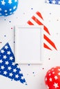 Fourth of July concept. Top view vertical photo of photo frame national flag garland balloons and confetti on isolated white