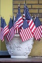 Celebratory American flags stand in solidarity in planter