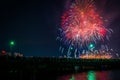 Fourth of July fireworks over the Broad Canal at night, in Cambridge, Massachusetts.