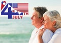 Fourth of July graphic with flags and ice cream against elderly couple looking out to sea Royalty Free Stock Photo