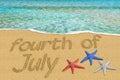 Fourth of July text inscription on the sand shore tropical clear sea. Independence day