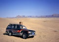 Girl driving fourwheeldrive in the desert Royalty Free Stock Photo