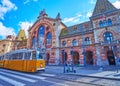 Fovam Square with riding yellow tram, Budapest, Hungary