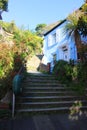 A Fowey \'backstreet\' with steps, giving access up the steep slope on which Fowey is built, in Cornwall England Royalty Free Stock Photo