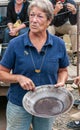 Woman shows gold dust in her pan, Eldorado Gold Mine, Fox, Alaska, USA Royalty Free Stock Photo