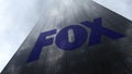 Fox Broadcasting Company logo on a skyscraper facade reflecting clouds. Editorial 3D rendering Royalty Free Stock Photo