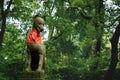 Fox kisune statue in forest at the Fushimi Inari Taisha shrine in Kyoto, Japan Royalty Free Stock Photo