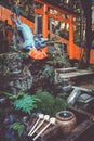 Fox purification fountain at Fushimi Inari Taisha, Kyoto, Japan Royalty Free Stock Photo