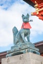 Fox statue at the main gate of Fushimi Inari Shrine. Foxes are thought to be Inari`s messengers.