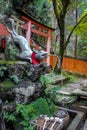 Fox Statue Water fountain in Fushimi Inari Shrine - Kyoto, Japan Royalty Free Stock Photo