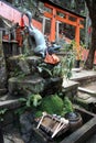 Fox Statue Water fountain in Fushimi Inari Shrine Royalty Free Stock Photo